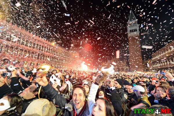Crowd celebrates New Year in St. Mark's Square in Venice