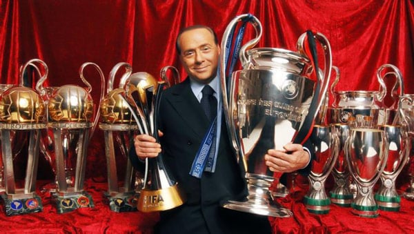 Berlusconi with Milan club trophies and cups