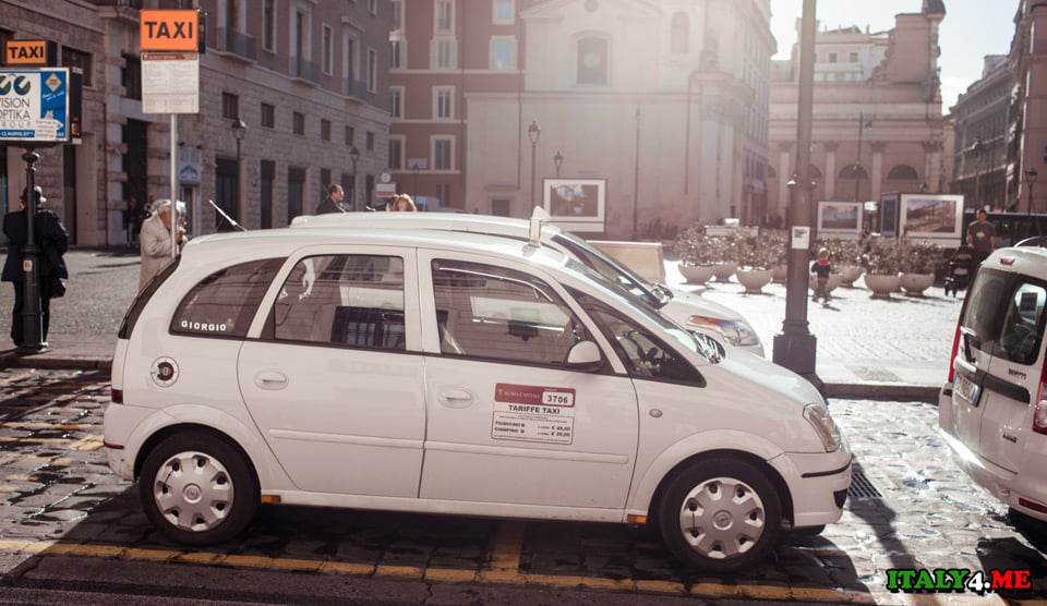 city taxis in Rome are white, usually Toyota Auris hybrid cars