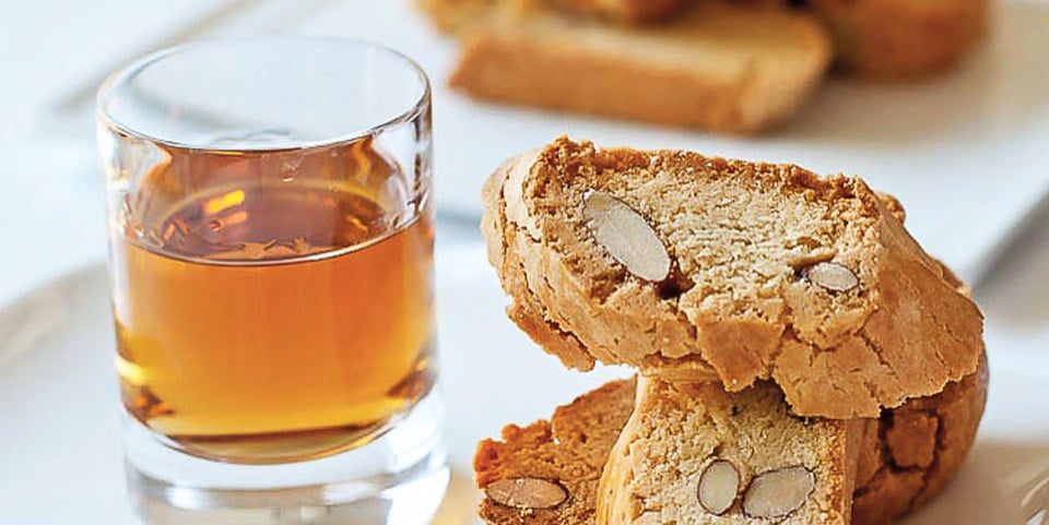 Florentine small almond biscuits cantucci and sweet amber liqueur wine Vin Santo