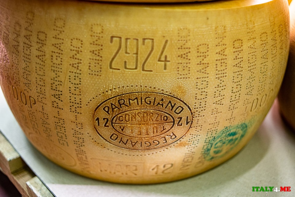 Parmesan cheese head with production date, quality mark and name