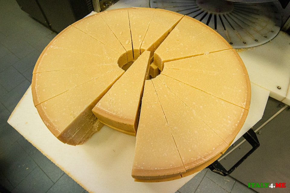 Cutting head of Parmesan into triangular pieces for sale